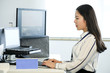 © jeson - Asian female white collar worker using computer