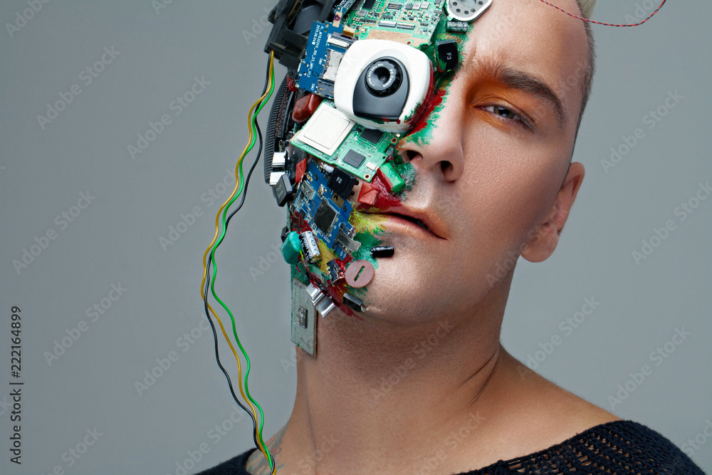 Studio photo of man cyborg, half face computer elements and with professional make-up, white Iroquois on head. Future technology concept - obrazy, fototapety, plakaty 