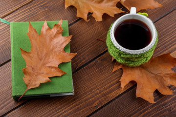 Strong coffee and a book. The concept of autumn, still life, relaxation, study.