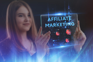 The concept of business, technology, the Internet and the network. A young entrepreneur working on a virtual screen of the future and sees the inscription: Affiliate marketing