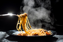 The Steam From Spaghetti With Tomato Sauce - Homemade Healthy Italian Pasta On Dark Background