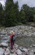 © expressiovisual - Woman hiking with a straw hat and backpack through the Spanish Pyrenees