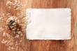 © Ester_K - Handmade paper mockup on a wooden table with white field flowers in a vase