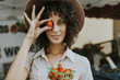 © Rawpixel.com - Beautiful woman buying tomatoes at a farmers market