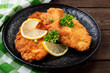 © Nelea Reazanteva - Homemade breaded german weiner schnitzel with potatoes. top view