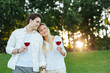 © zinkevych - Beautiful nature. Joyful happy couple standing together in the field while enjoying beautiful nature