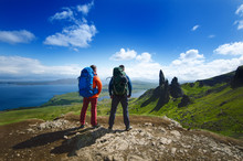 Tourist Friends On A Top Of Mountains In A Scottish Highlands. Scotland Nature. Tourist People Enjoy A Moment In A Nature.
 Tourists Favourites Place In Scotland - Isle Of Skye.