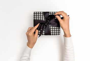 Woman making a gift box on a white background