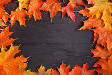 Wall Mural - autumn frame composition with fallen leaves on wooden with copy space for text. thanksgiving, hallow