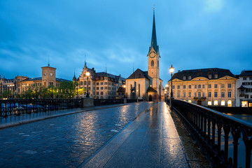 Wall Mural - View of historic Zurich city center with famous Fraumunster Church and river Limmat at Lake Zurich , in twilight, Canton of Zurich, Switzerland.