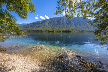 Sticker - Swimmers in Emerald water of lake Bohinj