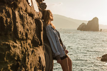 Young Blond Woman Observing The Horizon In An Island In A Sunset Of Summer