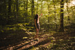 © Angel Ruiz Sanchez - Young brunette with a dress and long hair relaxing in the middle of the forest in a sunset of summer