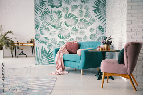 Chair And Turquoise Sofa In Green Living Room Interior With
