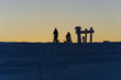 silhouettes of people on winter landscape