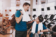 © VadimGuzhva - Young Father and Son near Treadmills in Modern Gym