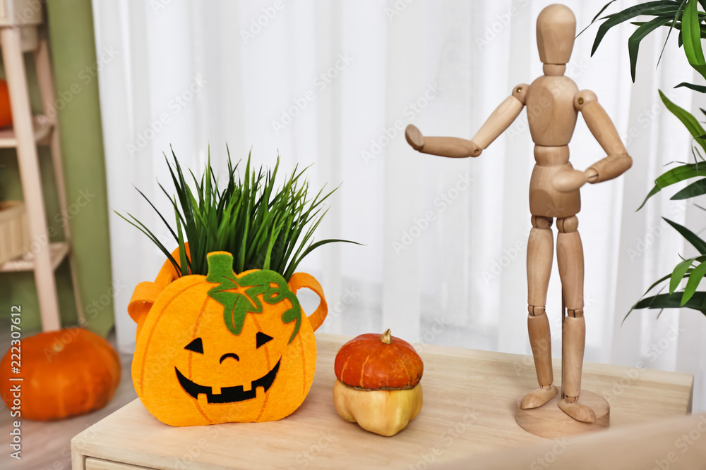 Creative decor prepared for Halloween celebration on table in room