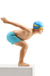 Little boy swimmer ready to jump