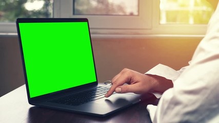 Doctor using laptop in the office. Young medical professional using touchpad on her laptop computer.