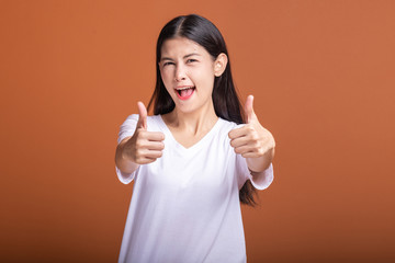 Wall Mural - Winning woman isolated over orange background.