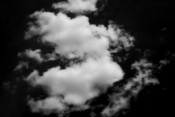 White fluffy clouds in the sky, black and white photo