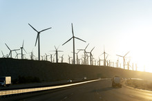 Giant Wind Turbines At Sunrise