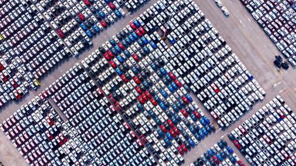 Wall Mural - New cars from the car factory parked at the port waiting for export to the country as ordered.