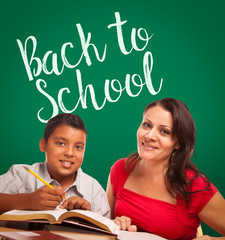 Wall Mural - Back To School Written On Chalk Board Behind Hispanic Young Boy and Famale Adult Studying