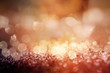 Abstract gold copper glittering bokeh background