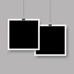 Wall Mural - two photo frames hanging on a clip. vector