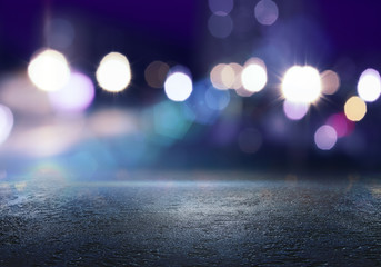 the background of an empty room with a concrete floor and blurred neon lights. abstract blue backgro