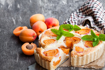 Wall Mural - Homemade  cheese cake with apricot on wooden table