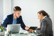 © Andrey Popov - Two Businesspeople Using Digital Tablet
