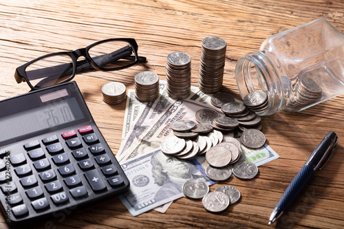 Fotografie, Obraz Currency And Calculator With Pen On Wooden Table