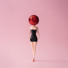 Wall Mural - girl in black dress with red disco ball head. minimal party concept.