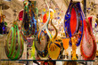 canvas print picture - Bright, colorful Murano glass vases and glassware on display in Venice shop window.