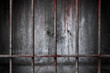 Old prison rusted metal bars cell lock with bloodstain and bloody background scary old wall, concept of strengthen and protect with horror