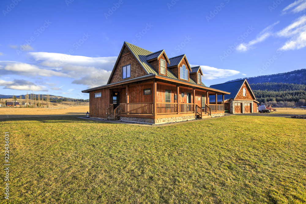 Nice wooden ranch home with beautiful landscape in the countryside. - obrazy, fototapety, plakaty 