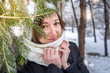 © allenkayaa - Portrait of a young woman in a winter forest near a spruce