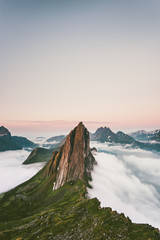 Wall Mural - Segla Mountain peak over clouds Landscape aerial view in Norway Travel destinations awesome scenery Senja islands