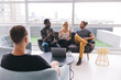 © Criene Images - Mixed Race group of business people chatting in meeting