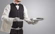 © ra2 studio - Waiter serving with white gloves and steel tray in an empty space