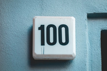 Number 100 Door Sign On Cold Background