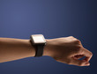 © ra2 studio - Close up female hand with smartwatch and dark background and black screen