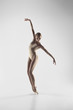 © master1305 - Young graceful female ballet dancer or classic ballerina dancing on white studio. Caucasian model on pointe shoes