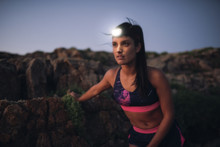 Sportive Woman With Headlamp In The Evening