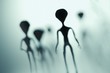 Spooky silhouettes of aliens and bright light in background. 3D rendered illustration.
