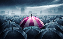 Pink And White Umbrella With Dark Stormy Clouds. Concept For Success.