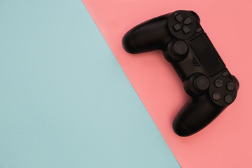 Canvas Print - Video games gaming controller isolated on blue pink background