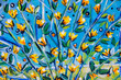 Details of acrylic paintings showing colour, textures and techniques. Expressionistic  tree branches with yellow spring blossom.